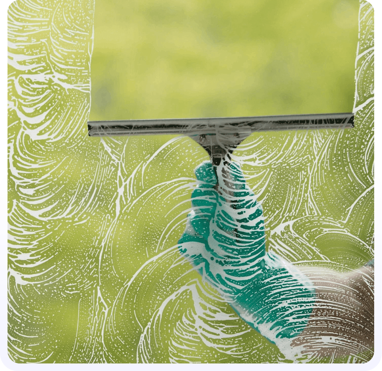 A person in gloves holding a window cleaner