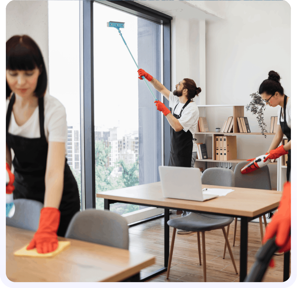 A group of people cleaning up in an office.
